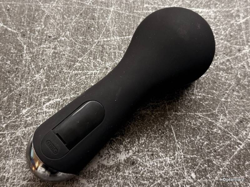 The back of the COSLUS Facial Cleansing Brush with the rubber charging cover closed.