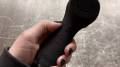 COSLUS Facial Cleansing Brush in the author's hand.