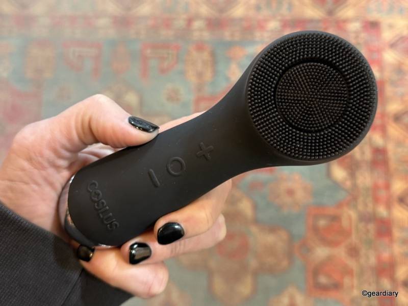 COSLUS Facial Cleansing Brush in the author's hand.