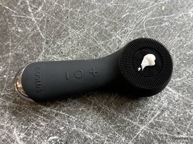 A dab of facial cleanser on the COSLUS Facial Cleansing Brush.