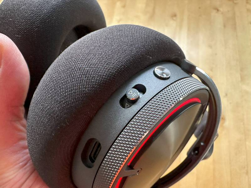Red lighting on the Corsair Virtuoso Max ear cup.