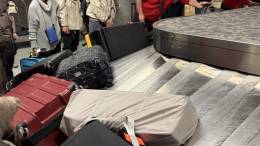 LEVEL8 Voyageur Checked 30" on a luggage conveyor belt at DFW