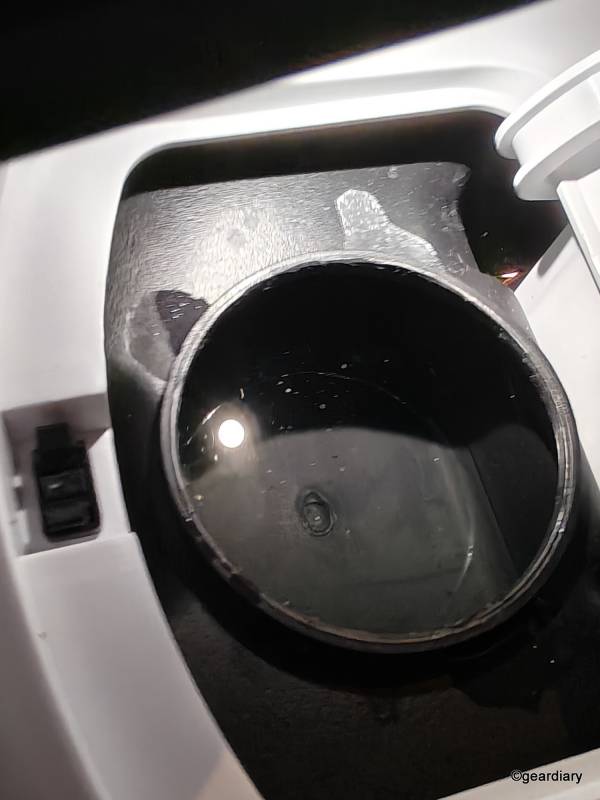 The only thing that looks like it might be a drain hole in the top reservoir.
