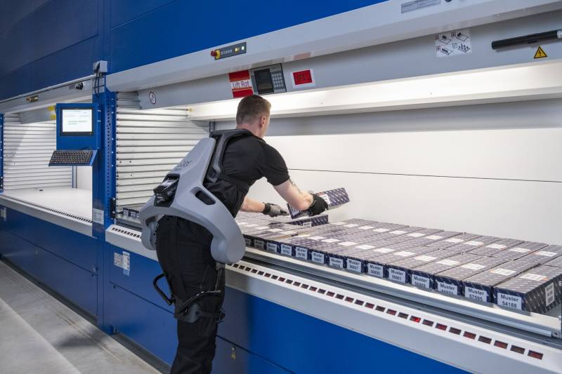 A production line worker wearing the Exia from German Bionics.