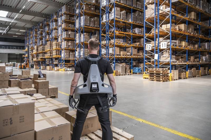 A warehoouse worker wearing the Exia from German Bionics.
