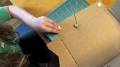 The author's son cutting cardboard with the ChompSaw
