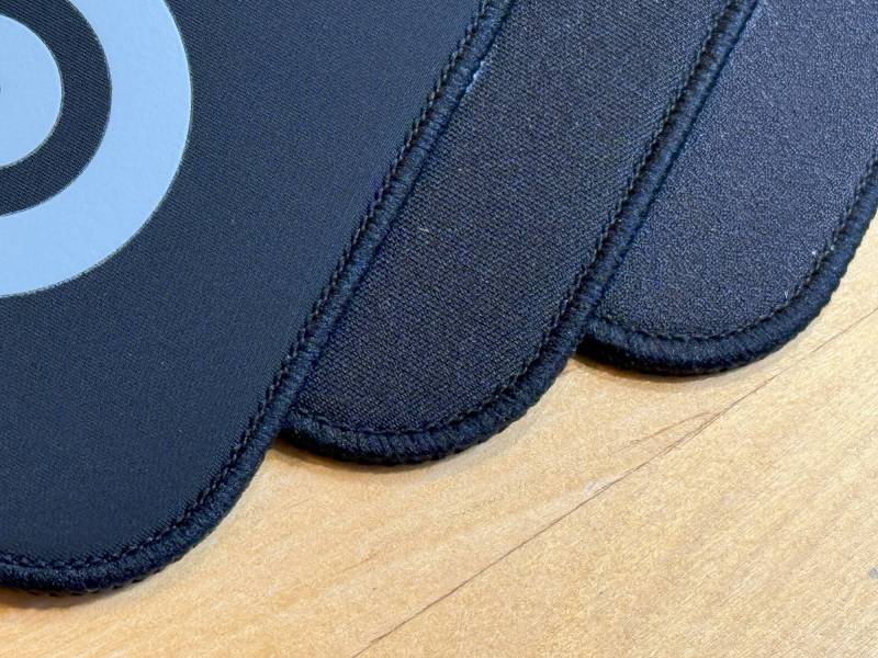 The different surfaces of the three SteelSeries QcK Performance Series Mousepads