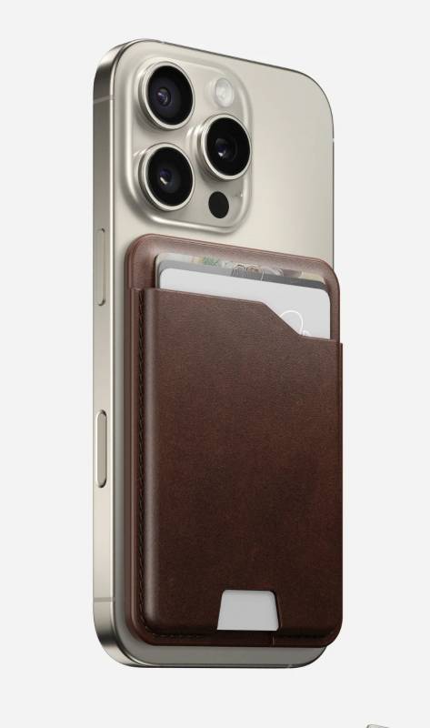 The Nomad Leather Mag Wallet on the back of an iPhone