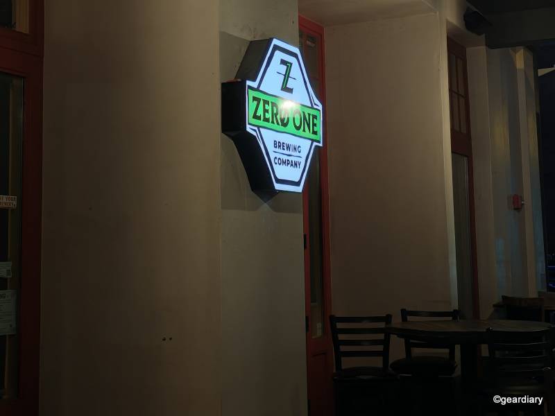 2025 Motorola Razr Ultra Review: Three Months with the Foldable Flip-Phone That’s Still the One to Beat 25 A low light shot of a restaurant sign with a table and chairs underneath