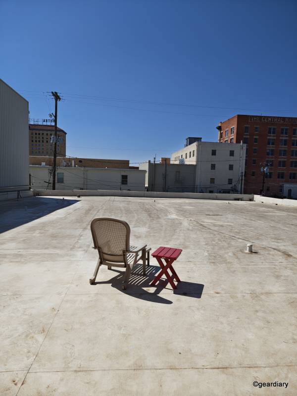 2025 Motorola Razr Ultra Review: Three Months with the Foldable Flip-Phone That’s Still the One to Beat 37 Photo of a lawn chair and table on a rooftop with a city view