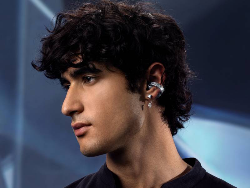 The Brilliant Collection - man with dark hair and a dark shirt wearing the moto buds loop in his left ear