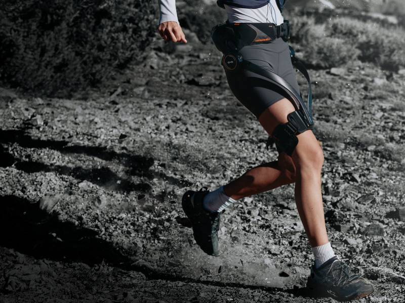Hypershell X Ultra Exoskeleton Will Allow You to Hike Farther, Cycle Easier, and Conquer Any Terrain 6 Man running while wearing the Hypershell X Ultra