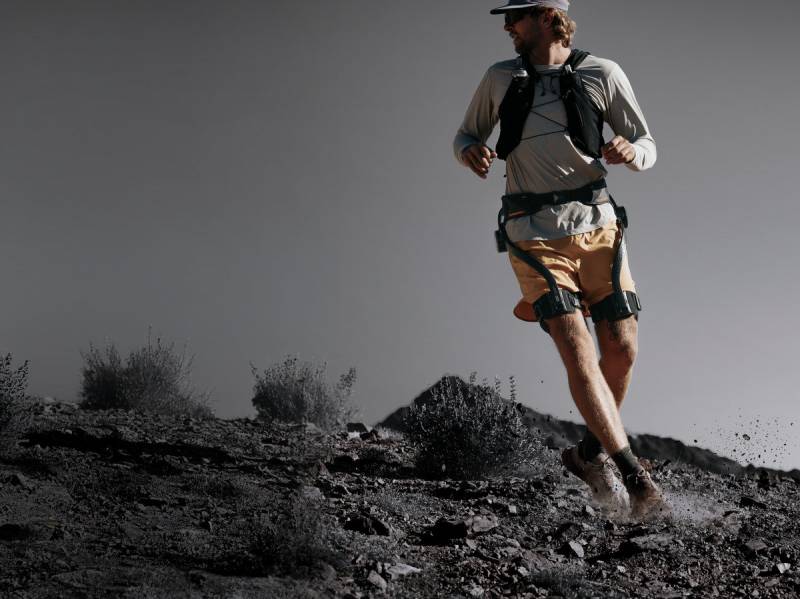 Hypershell X Ultra Exoskeleton Will Allow You to Hike Farther, Cycle Easier, and Conquer Any Terrain 1 Man running while wearing the Hypershell X Ultra