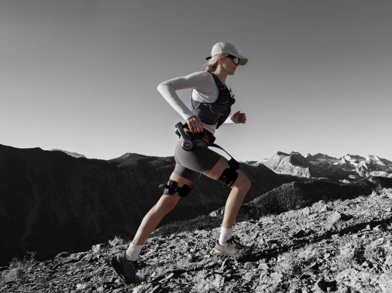 Hypershell X Ultra Exoskeleton Will Allow You to Hike Farther, Cycle Easier, and Conquer Any Terrain 3 Woman running while wearing the Hypershell X Ultra