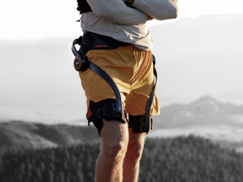 Hypershell X Ultra Exoskeleton Will Allow You to Hike Farther, Cycle Easier, and Conquer Any Terrain 2 Man in yellow shorts wearing the Hypershell X Ultra
