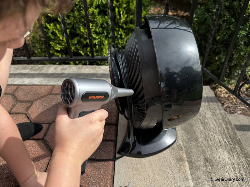 WOLFBOX MF200 Compressed Air Duster Review: The Cordless Cleaning Tool That Actually Replaces Canned Air 7 Using the WOLFBOX MF200 on a dirty fan