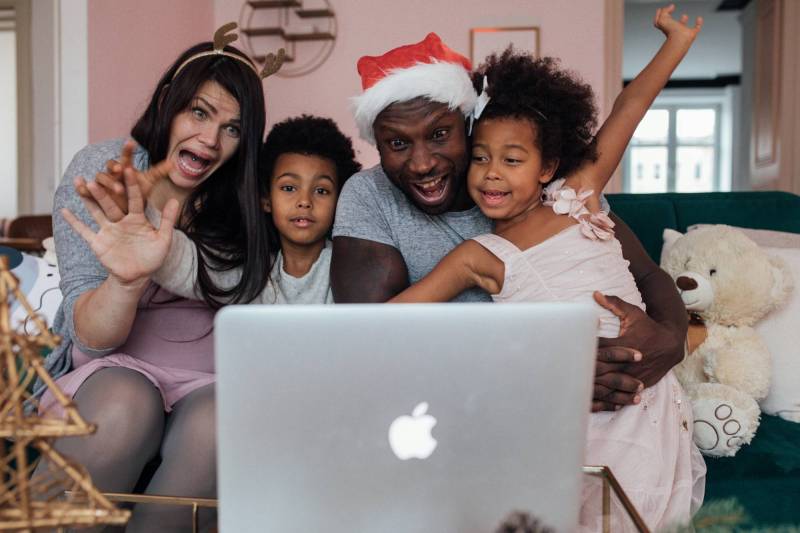 Gear Diary’s 2025 Holiday Gift Guide & Giveaway: Smart Home Tech, Cozy Gadgets, and Connected Comfort 1 A family gathered around a laptop for a holiday video call
