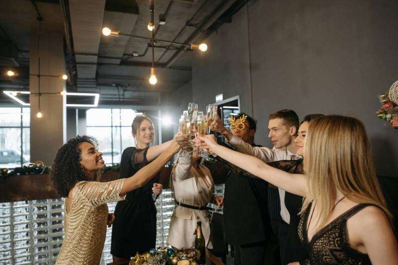 Holiday revelers clinking their glasses in cheers