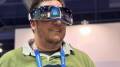Caleb wearing the SKG KS700-E