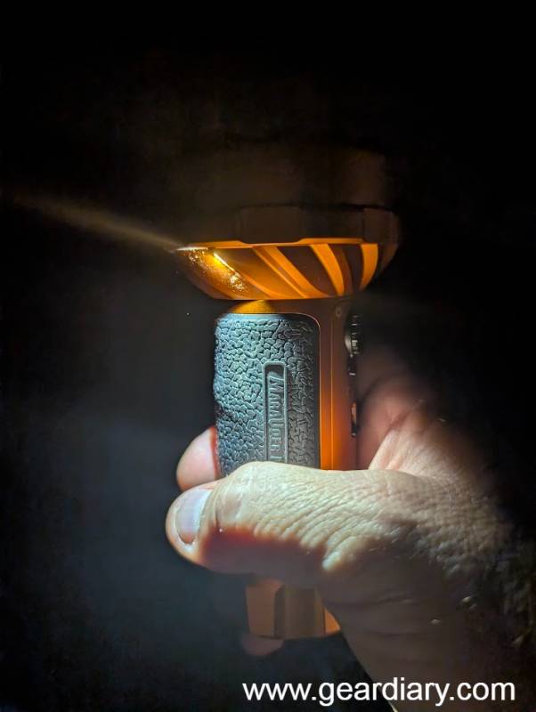 Olight Marauder Mini 2 Review: A Compact 10,000-Lumen Flashlight Built for Serious Outdoor and Emergency Use 7 The author holding the Olight Marauder Mini 2