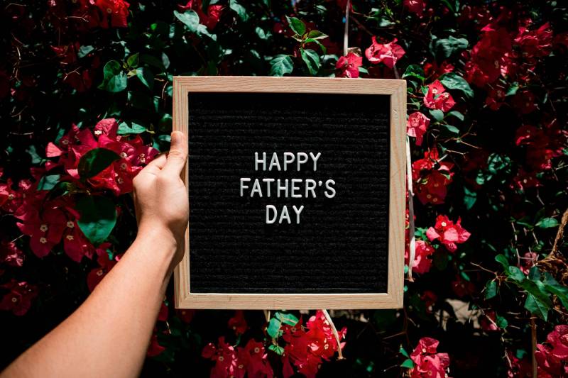 Gear Diary's 2026 Father's Day Gift Guide & Giveaway: Smart, Stylish, and Useful Gifts That Dad Will Love 1 A hand holds a board that says Happy Father's Day.