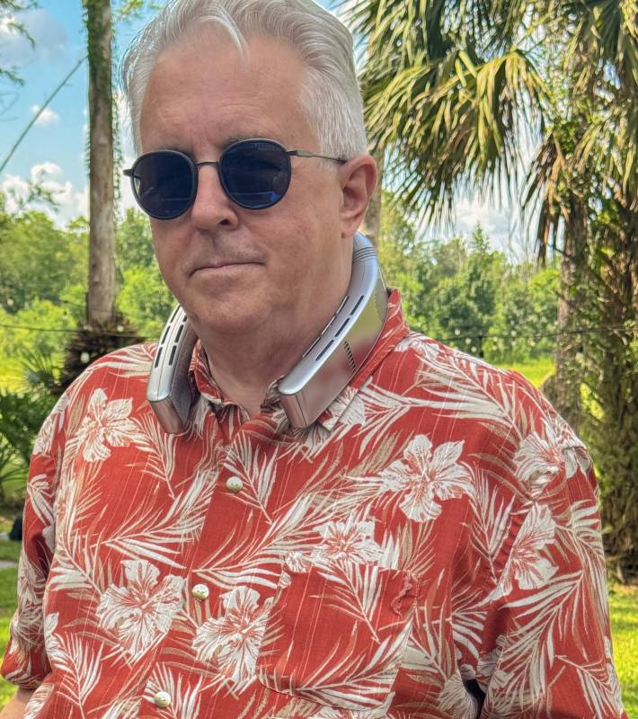TORRAS COOLiFY Cyber Fold AI Neck Air Conditioner Review: Your Personal AC for Surviving Summer Heat 1 The author wearing the TORRAS COOLiFY Cyber Fold AI Neck Air Conditioner