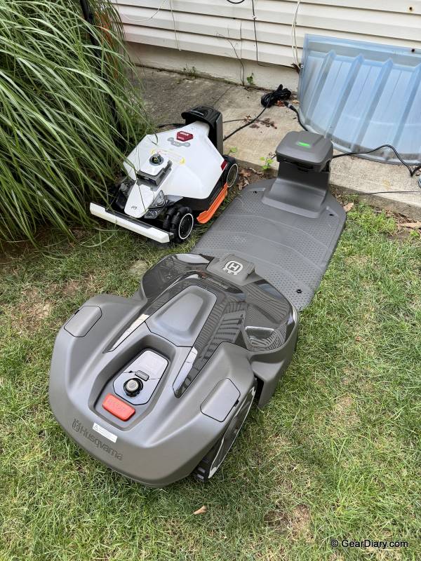 Husqvarna Automower 420 iQ Review: The Safe Bet in Robotic Mowing 25 Husqvarna Automower 420 iQ mower next to Mammotion mower