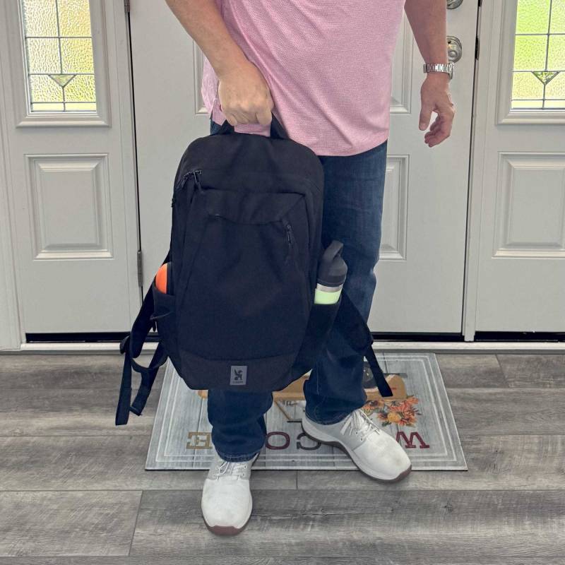 Chrome Industries Recruit 22L Pack Review: A Tough, Nimble Day Tripper That's Easy to Live With! 32 The author holding the Chrome Industries Recruit 22L Pack
