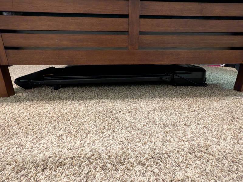 UREVO FoldiMix 5L Smart Treadmill Review: A Great Portable Treadmill That Packs Away Easily 15 UREVO FoldiMix 5L Smart Treadmill stored under the author's bed