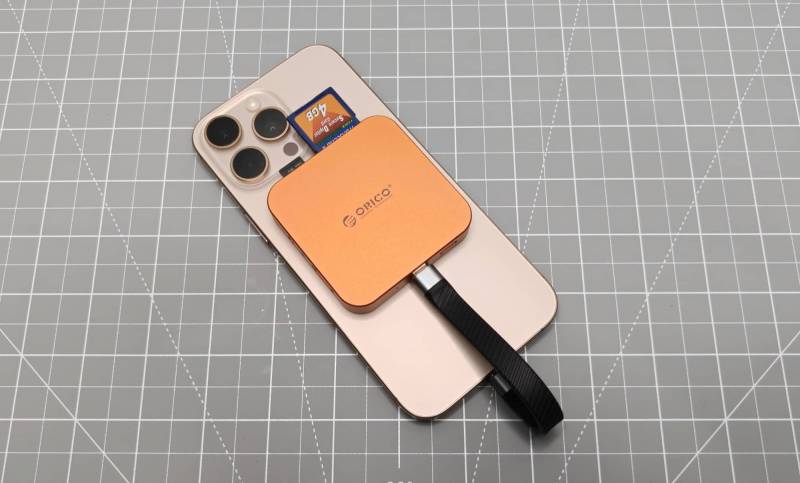 ORICO MG7 8-in-1 Magnetic Hub Review: A Handy iPhone Dock with One Hot Issue 12 ORICO MG7 attached to the back of an iPhone