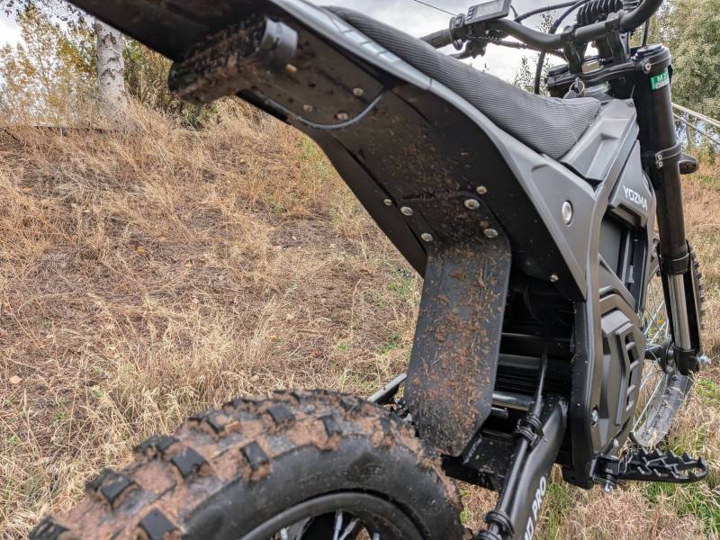 Yozma IN 10 Pro Electric Dirt Bike Review: This Dirt Bike Is Too Fun and Sadly Not Street Legal, So Keep It to the Trails! 19 Rear view of the Yozma IN 10 Pro Electric Dirt Bike after riding through mud