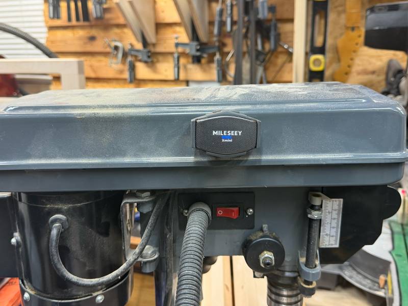Mileseey GripSound Xmini/GripSense SmartAudio System Review: Tiny Speaker, Tough Build, and Surprisingly Powerful Noise Cancellation 8 The Mileseey GripSound Xmini held to a drill magnetically.